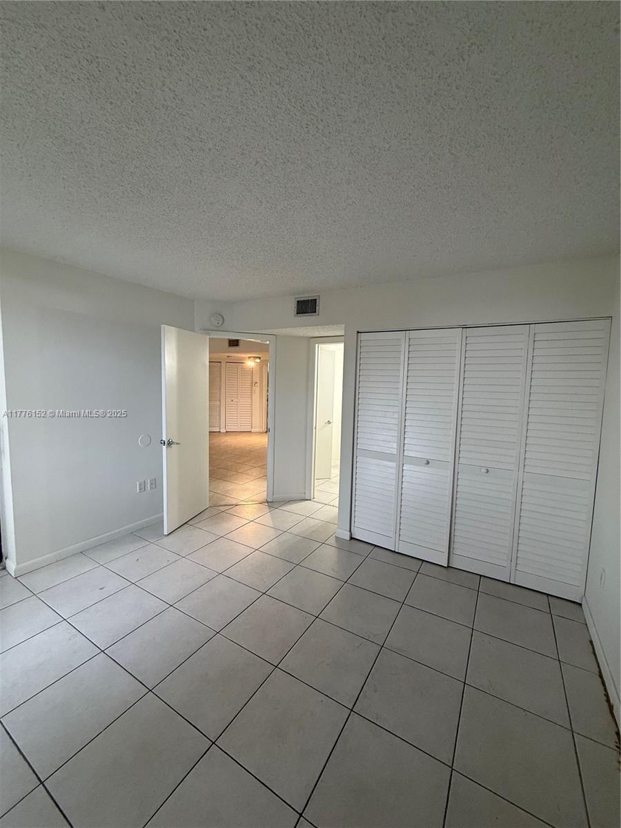 8335 Southwest 152nd Avenue, Unit B106 Miami, FL 33193 - Photo 12 of 27 a view of an empty room and window
