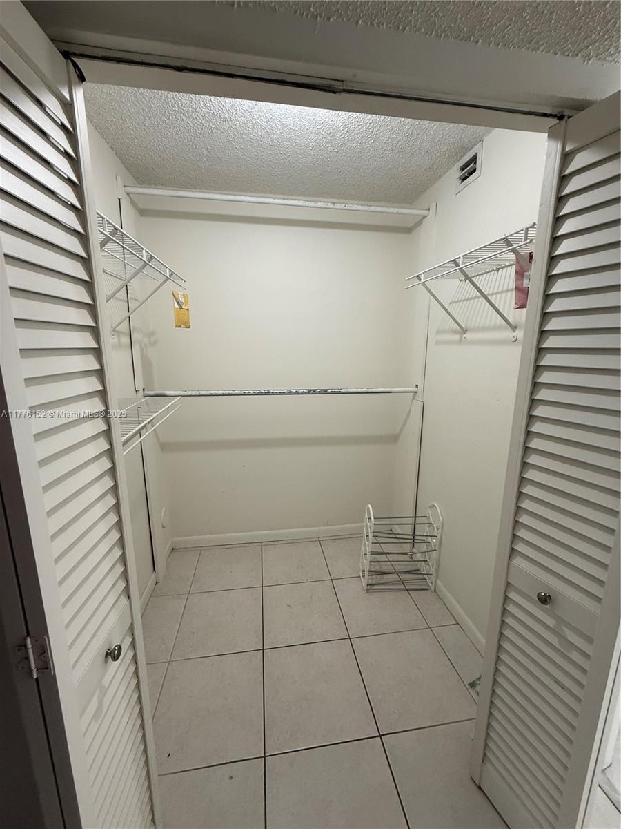8335 Southwest 152nd Avenue, Unit B106 Miami, FL 33193 - Photo 21 of 27 a view of a closet