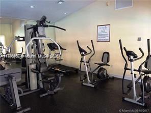 8335 Southwest 152nd Avenue, Unit B106 Miami, FL 33193 - Photo 25 of 27 a view of a room with gym equipment