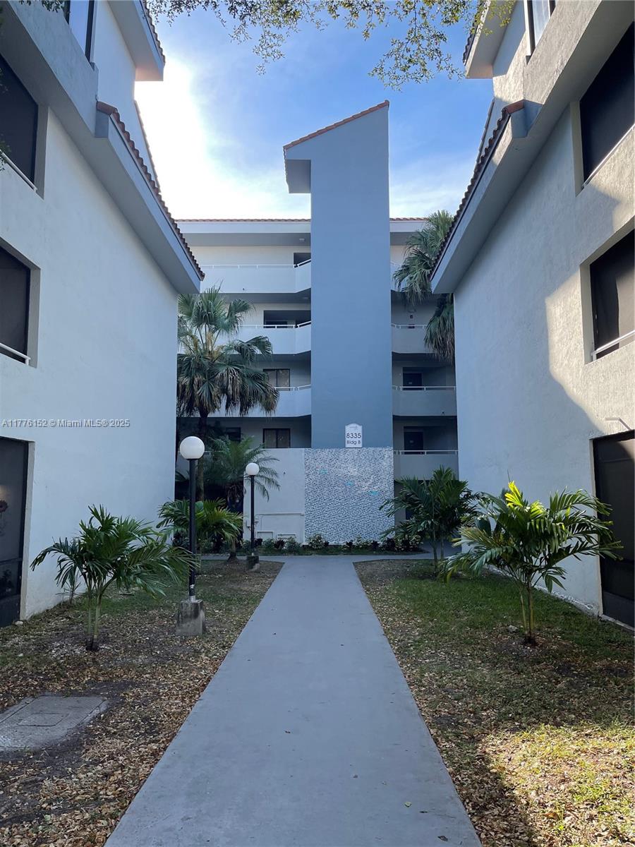 8335 Southwest 152nd Avenue, Unit B106 Miami, FL 33193 - Photo 3 of 27 a view of a house with a garden