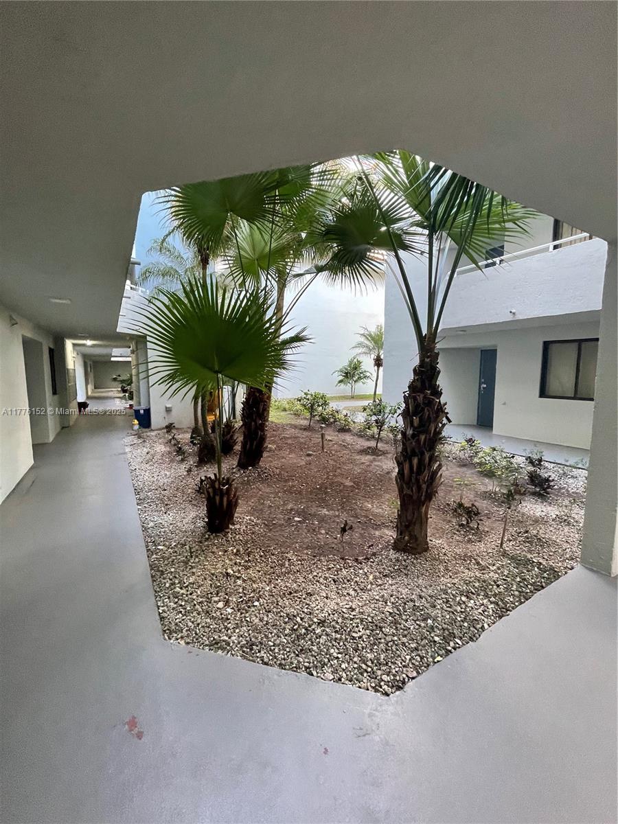 8335 Southwest 152nd Avenue, Unit B106 Miami, FL 33193 - Photo 6 of 27 a vase of flowers sitting on a table