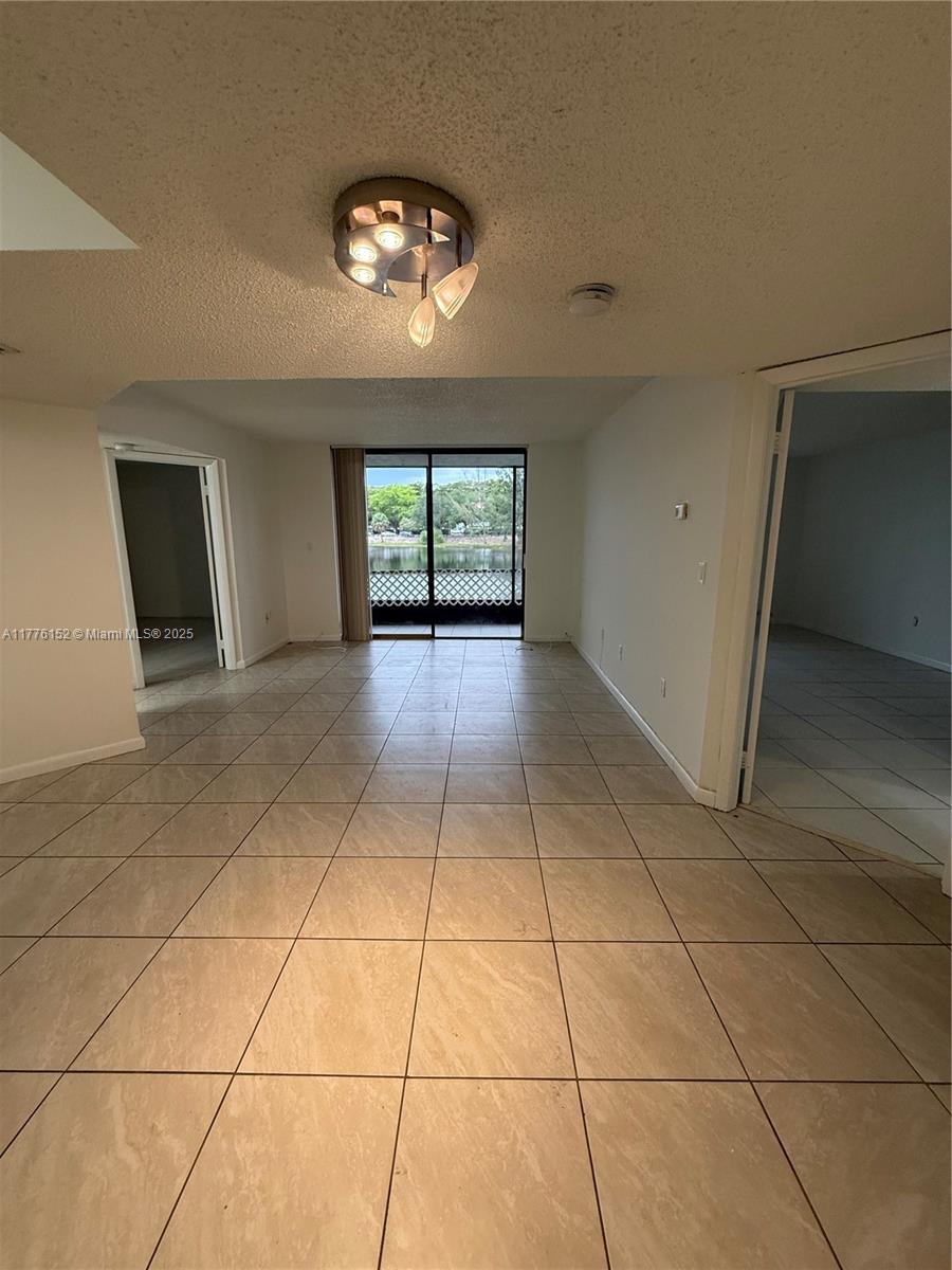 8335 Southwest 152nd Avenue, Unit B106 Miami, FL 33193 - Photo 8 of 27 a view of an empty room with a window