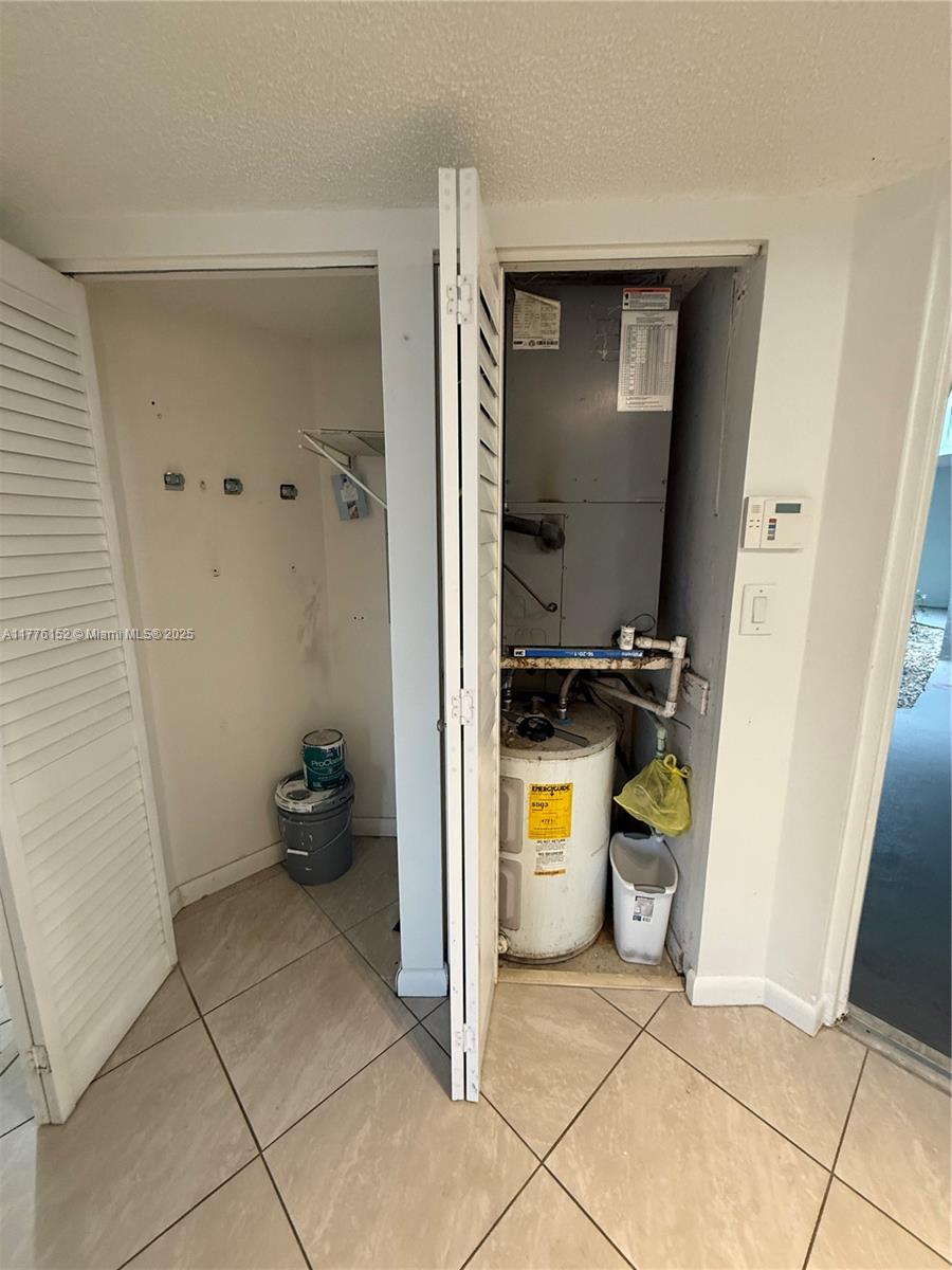 8335 Southwest 152nd Avenue, Unit B106 Miami, FL 33193 - Photo 9 of 27 a bathroom with a sink and a toilet