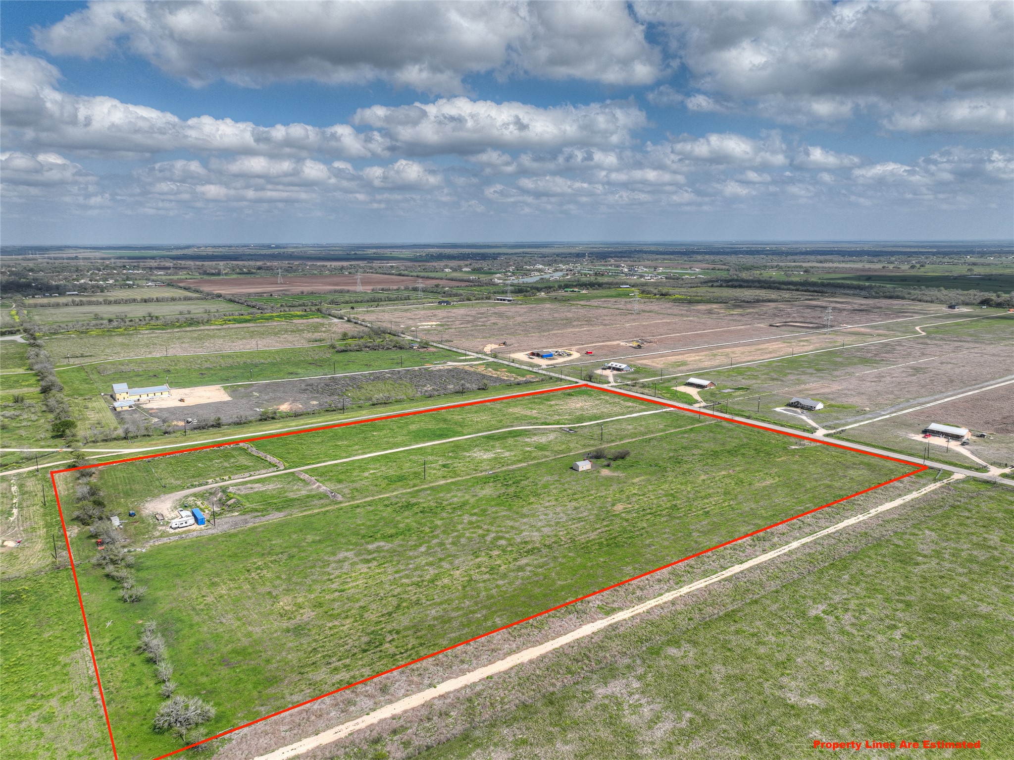 1492 Scull Road San Marcos, TX 78666 - Photo 6 of 10 Aerial view of sparsely populated area with property boundaries highlighted and rows of crops