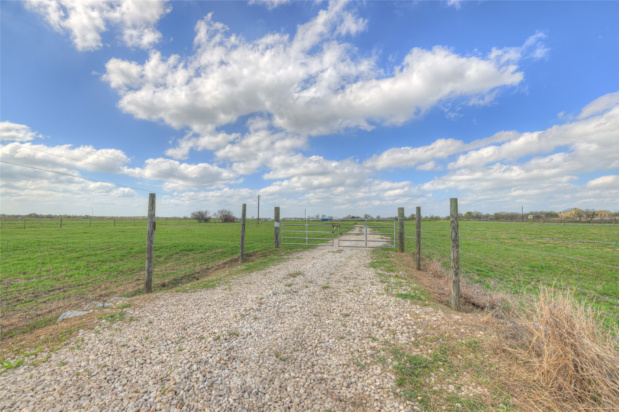 1492 Scull Road San Marcos, TX 78666 - Photo 7 of 10 View of street featuring a gate, a rural view, and a gated entry
