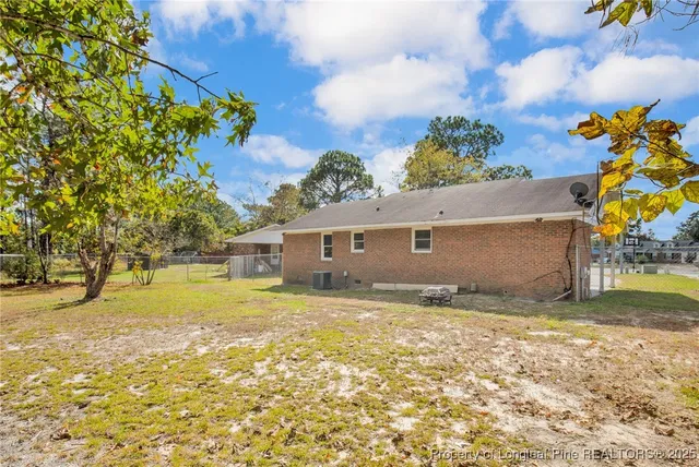 a view of a yard with a tree