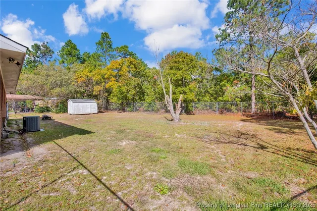 a view of backyard with tree
