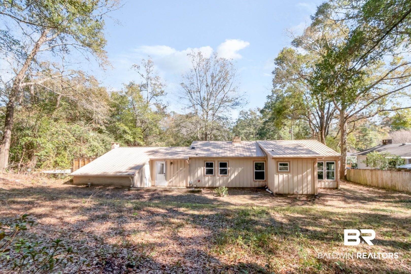 410 St John Place Mobile, AL 36609 - Photo 27 of 32 Rear view of property with board and batten siding