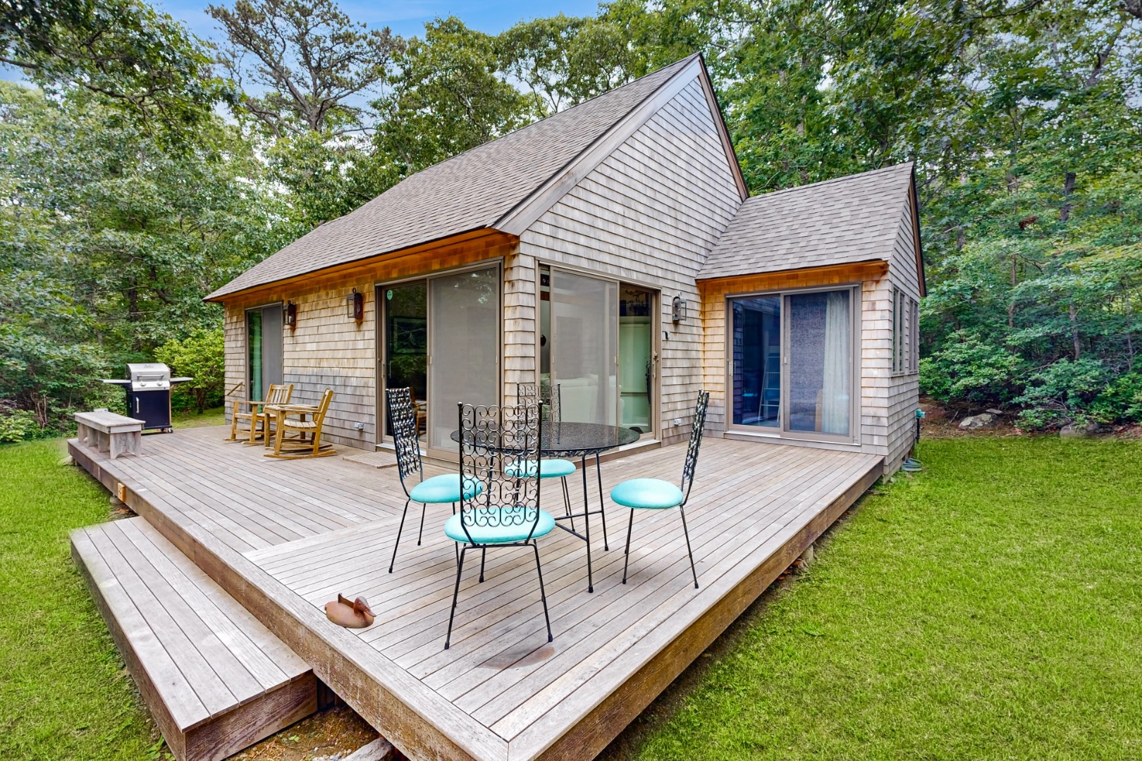 46 Tiercel Lane Chilmark, MA 02535 - Photo 18 of 20 a view of a house with backyard and a patio