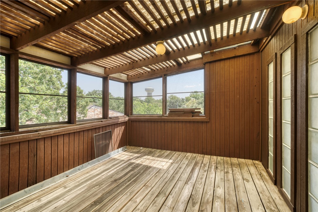 1513 Wolf Run College Station, TX 77840 - Photo 18 of 33 Unfurnished sunroom featuring beam ceiling