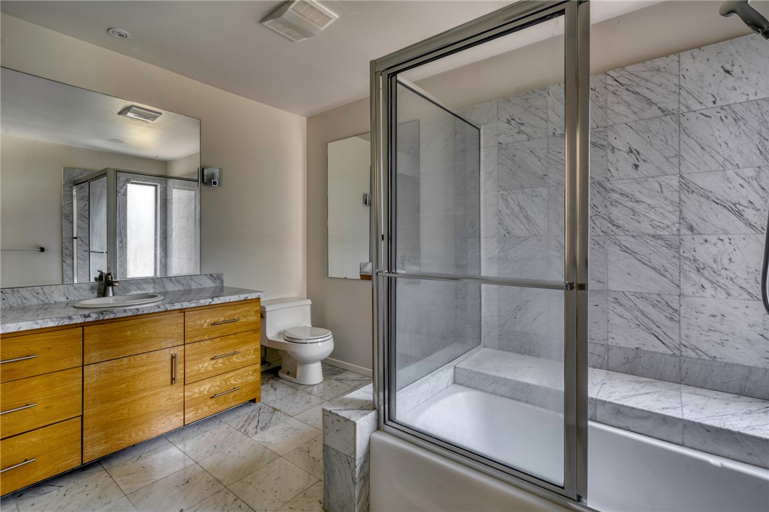 1513 Wolf Run College Station, TX 77840 - Photo 22 of 33 Bathroom with vanity and combined bath / shower with glass door