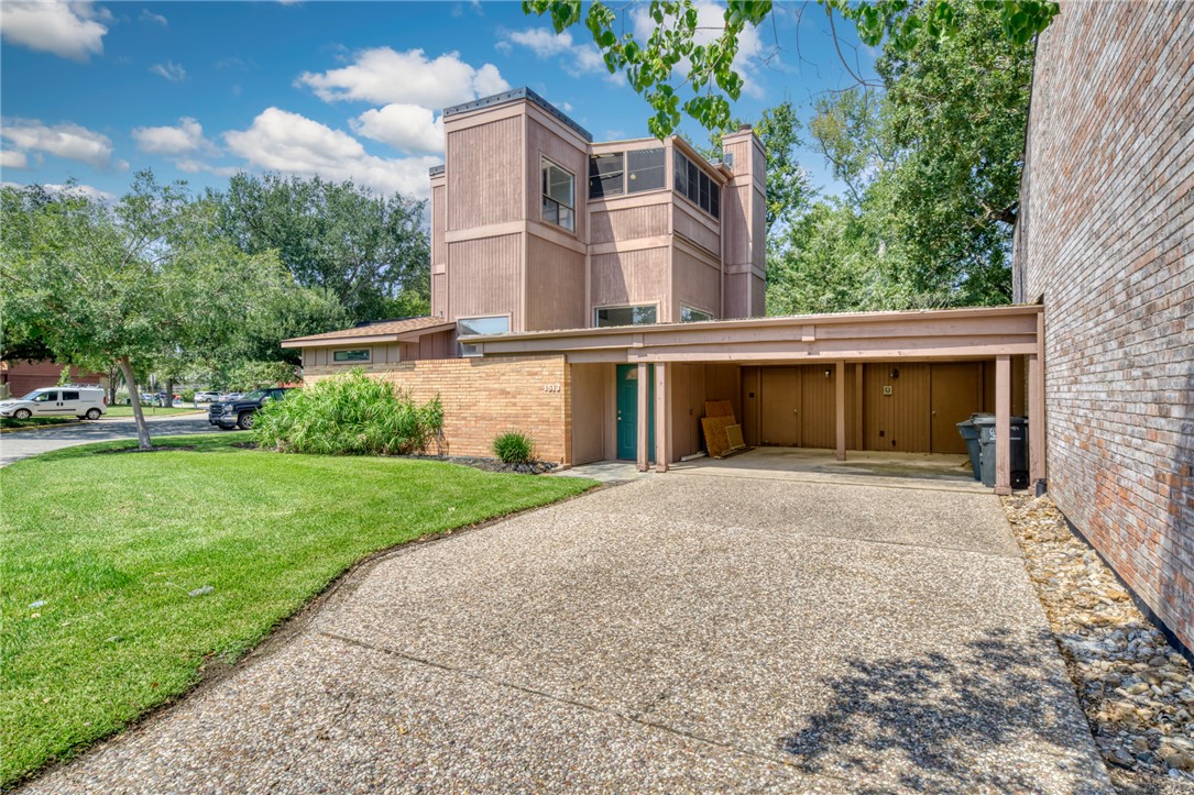 1513 Wolf Run College Station, TX 77840 - Photo 3 of 33 View of side of property with brick siding, a yard, and a chimney
