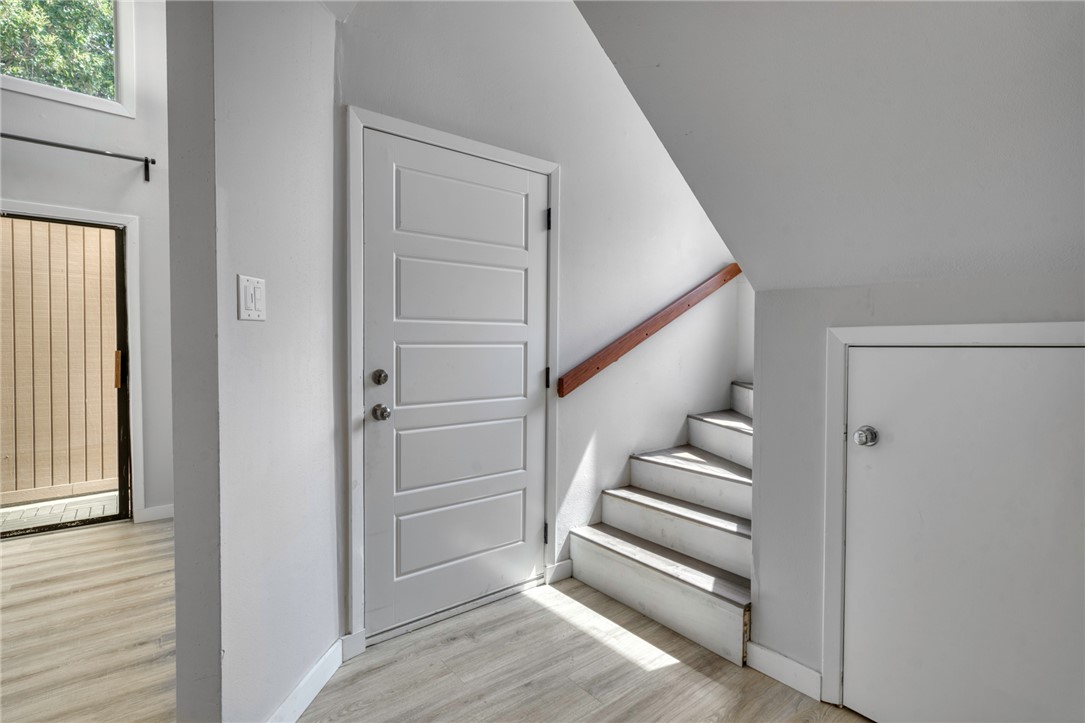 1513 Wolf Run College Station, TX 77840 - Photo 6 of 33 Staircase featuring wood finished floors and lofted ceiling