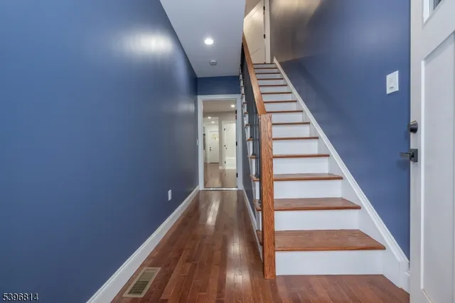 a view of entryway with wooden floor