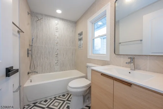 a bathroom with a sink a toilet and a bathtub
