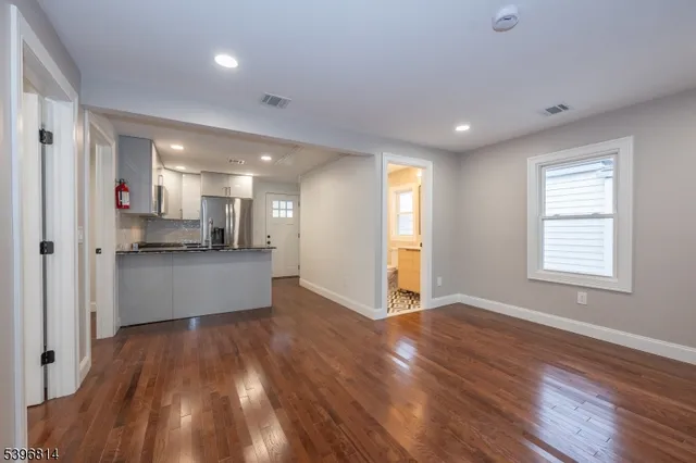 a view of kitchen and wooden floor