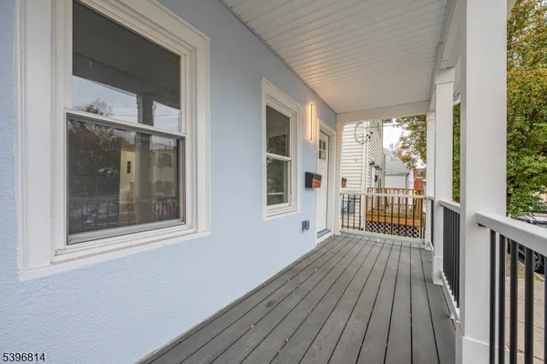 a view of a balcony with wooden floor