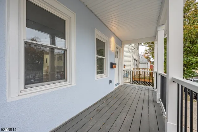 a view of a balcony with wooden floor