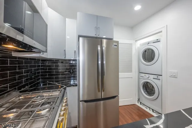 a view of a kitchen with washer and dryer