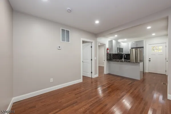 a view of kitchen with wooden floor