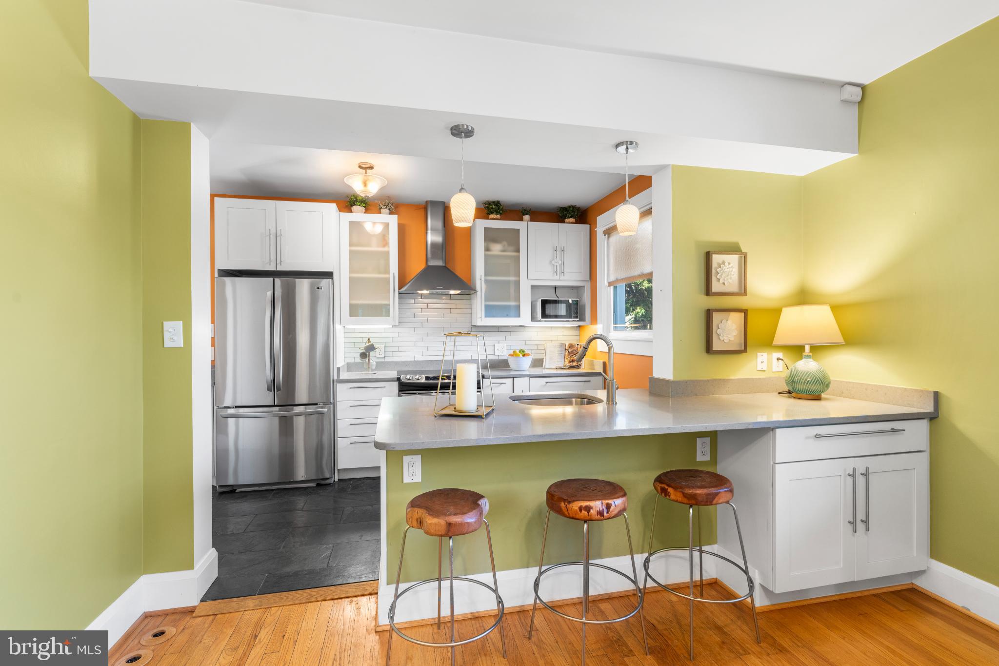 532 Overbrook Road Baltimore, MD 21212 - Photo 16 of 44 a kitchen with kitchen island a sink stove and refrigerator