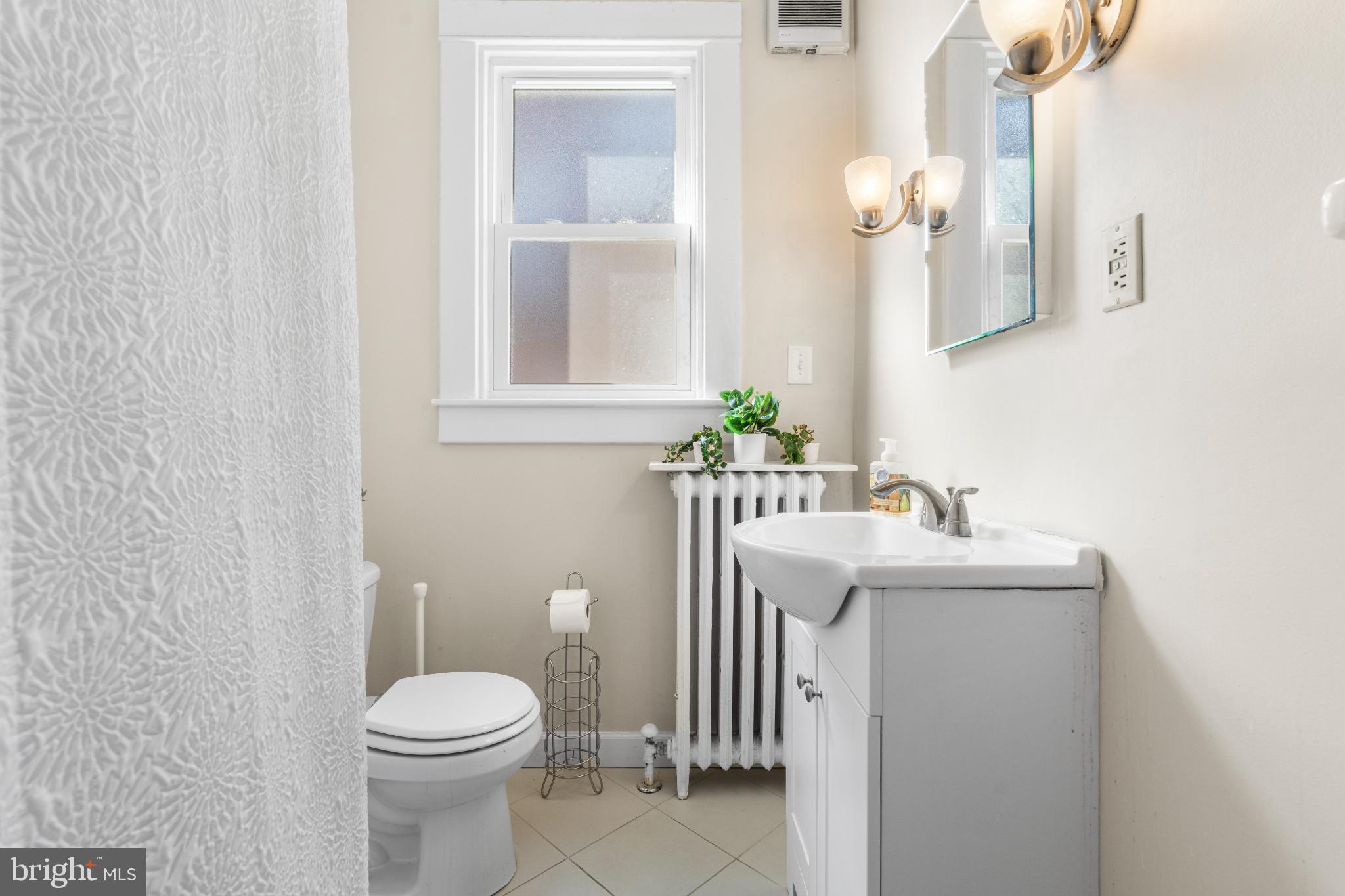 532 Overbrook Road Baltimore, MD 21212 - Photo 24 of 44 a bathroom with a sink a toilet and mirror