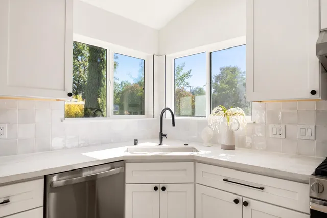 a bathroom with a sink and a window