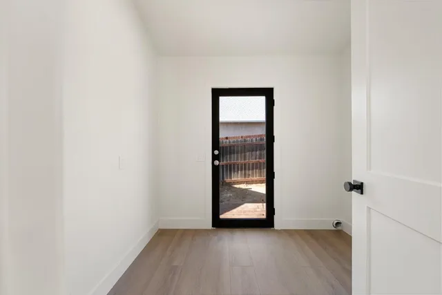 a view of an empty room with a window