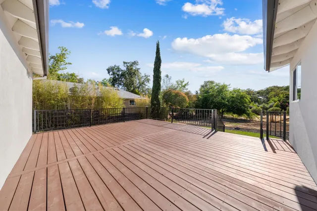 a view of outdoor sitting space with wooden deck
