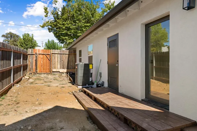 a view of a backyard of the house