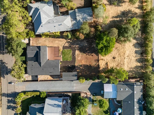 an aerial view of a house with a yard and garden view