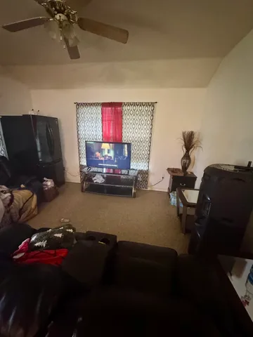 a room with furniture and a flat screen tv