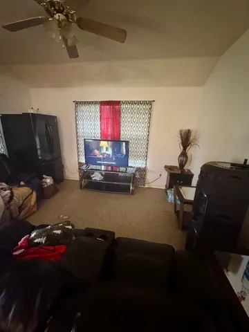 a room with furniture and a window