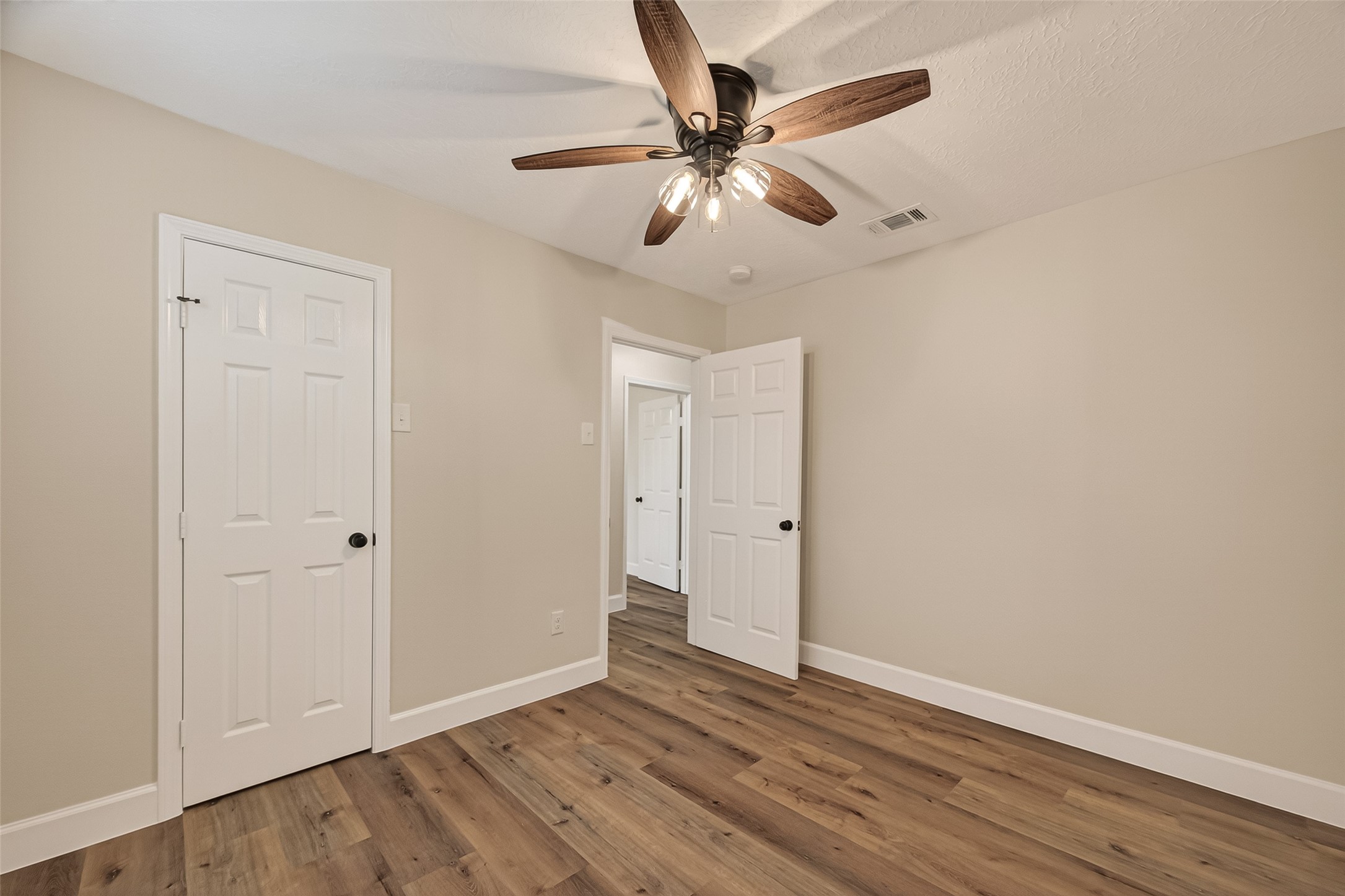 917 South Main Street Highlands, TX 77562 - Photo 20 of 45 a view of an empty room with wooden floor