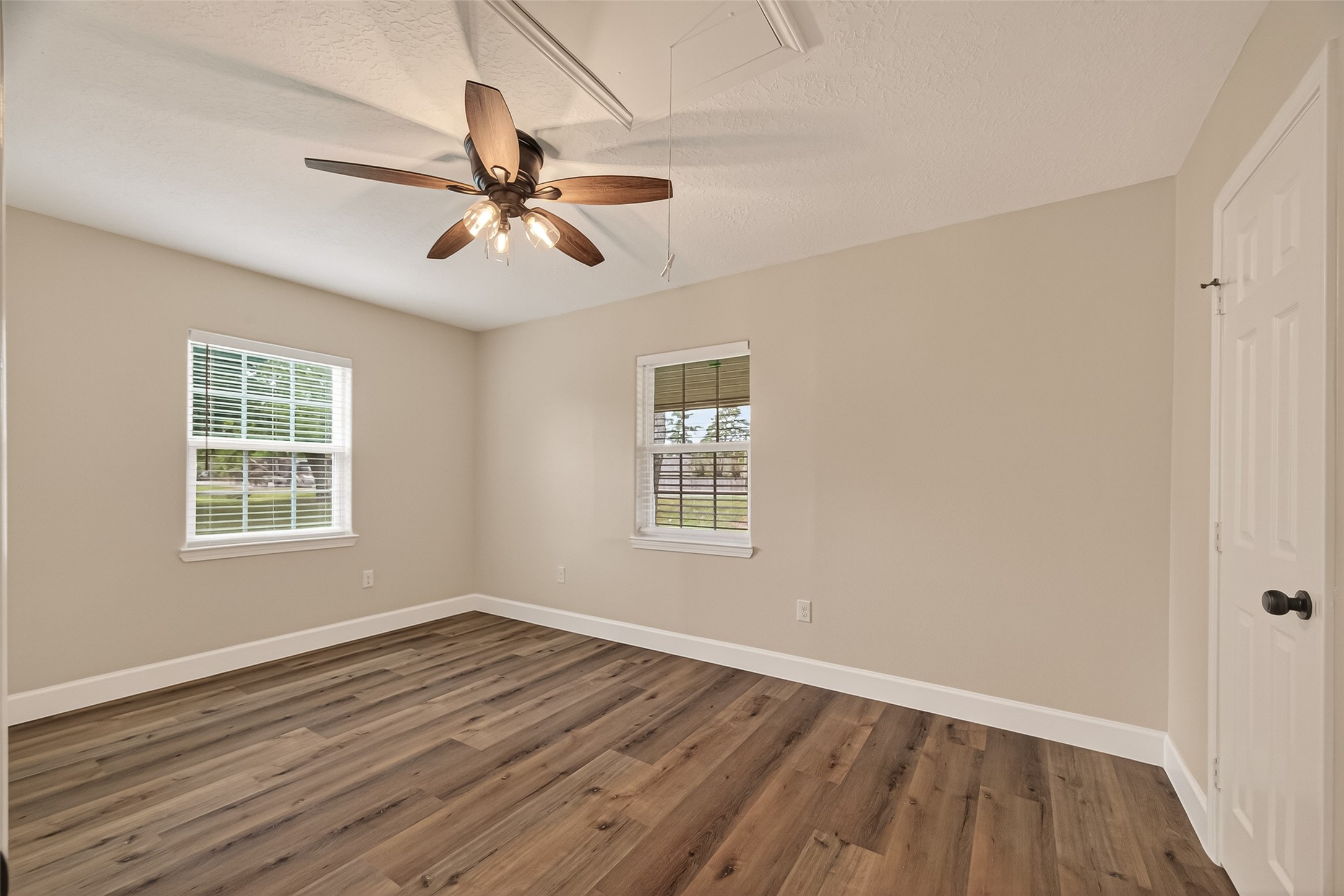 917 South Main Street Highlands, TX 77562 - Photo 21 of 45 wooden floor in an empty room with a window