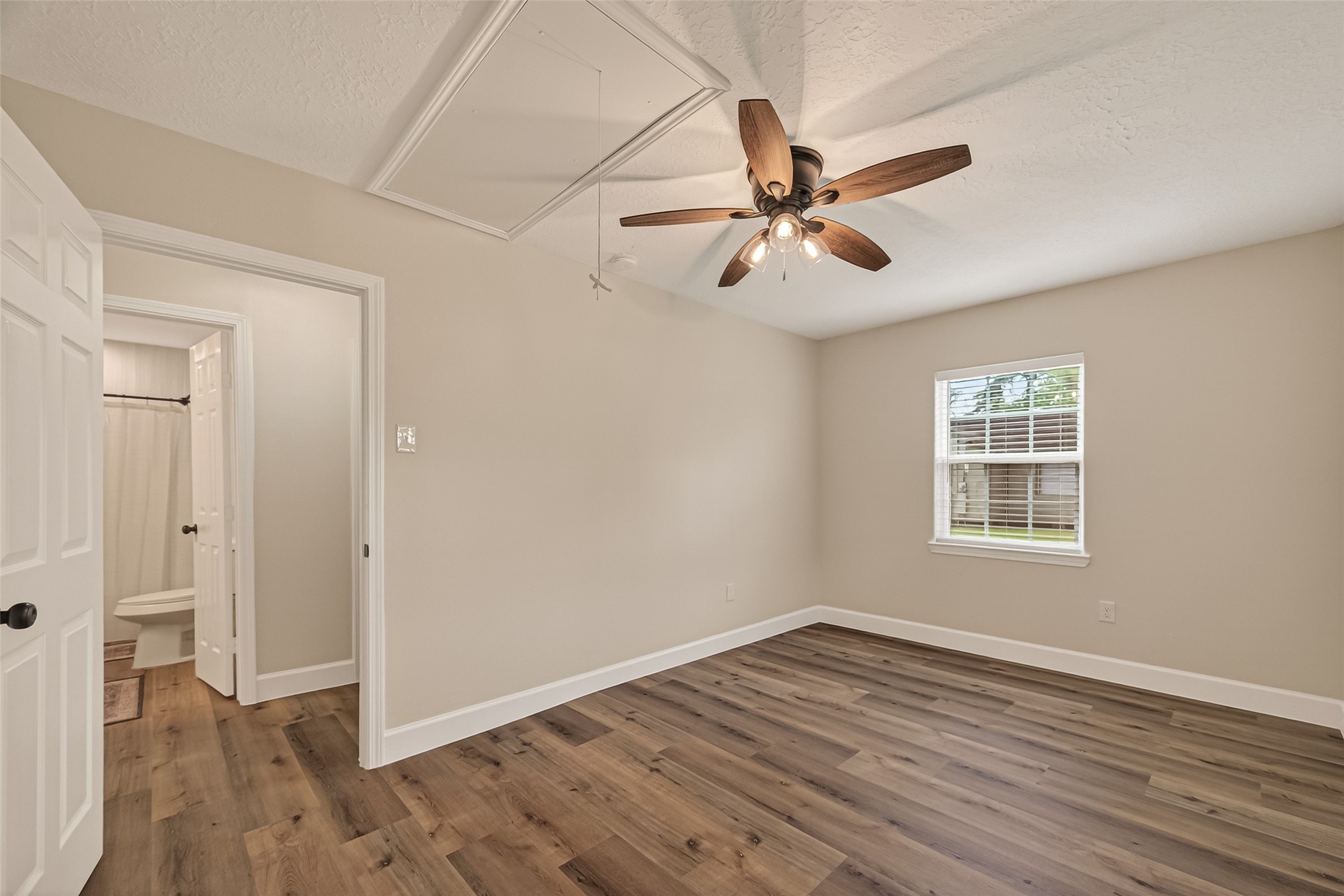 917 South Main Street Highlands, TX 77562 - Photo 22 of 45 a view of an empty room with wooden floor and a window