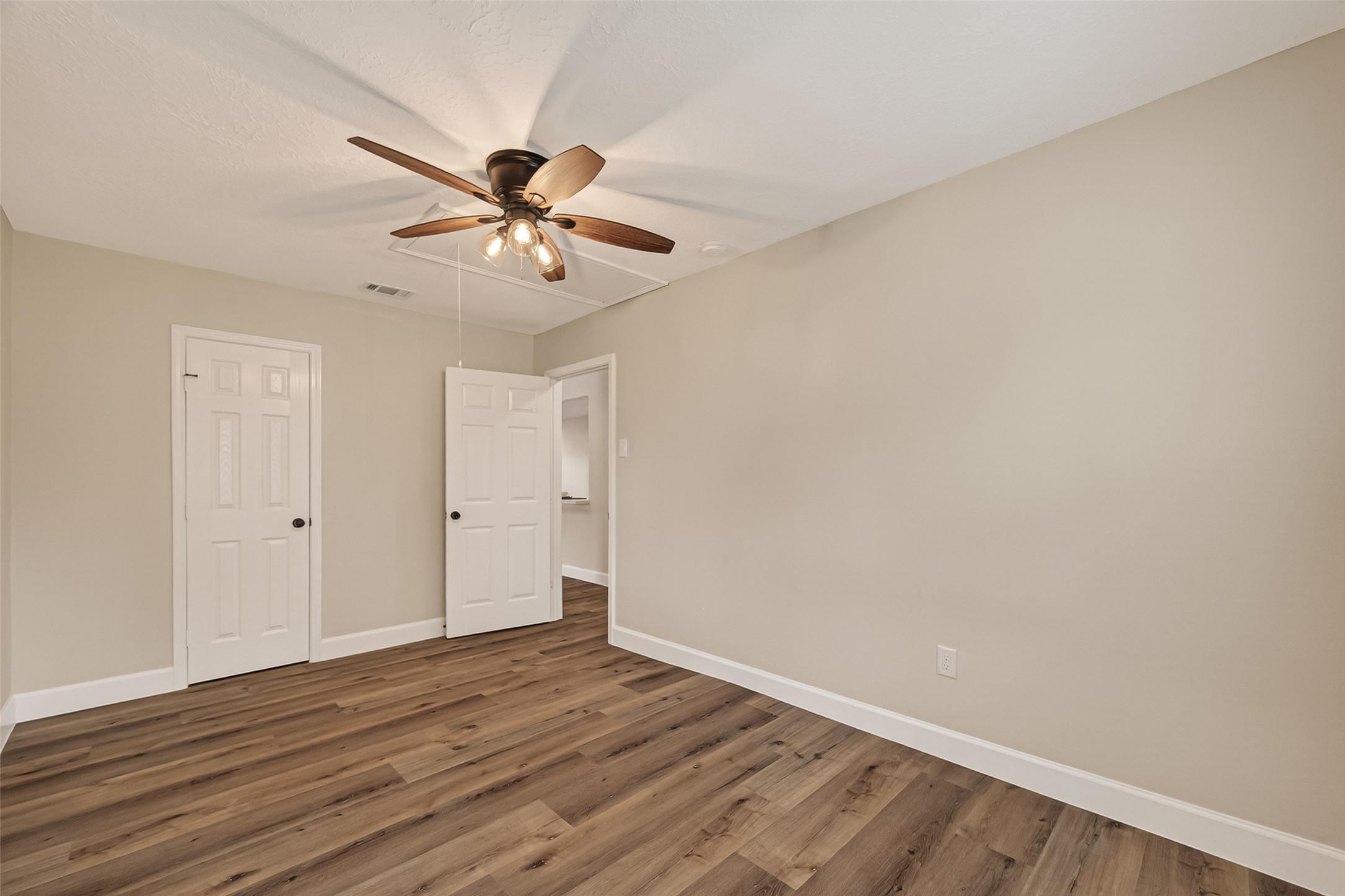 917 South Main Street Highlands, TX 77562 - Photo 23 of 45 a view of a big room with wooden floor and a fan