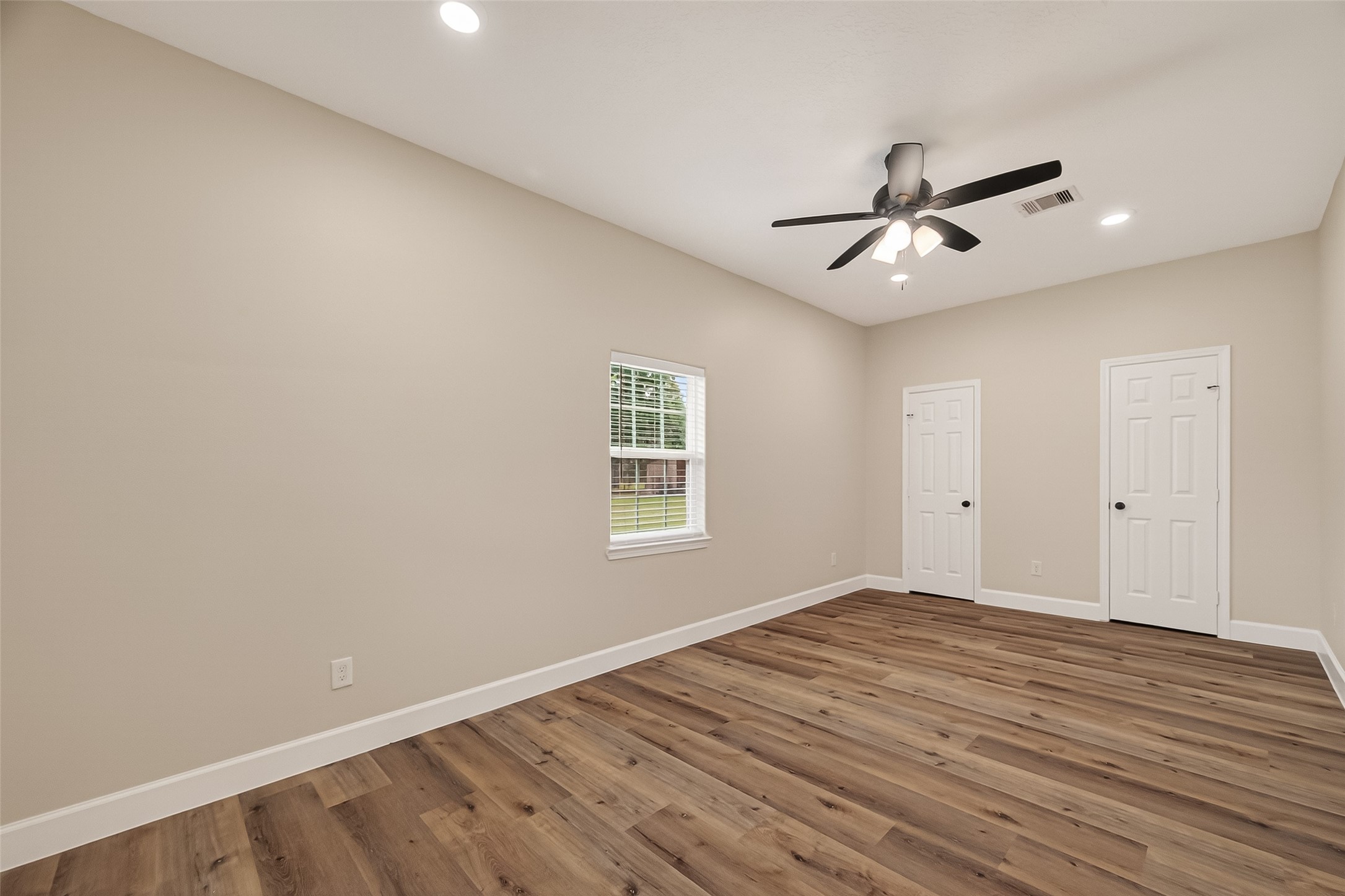 917 South Main Street Highlands, TX 77562 - Photo 27 of 45 a view of empty room with wooden floor and fan