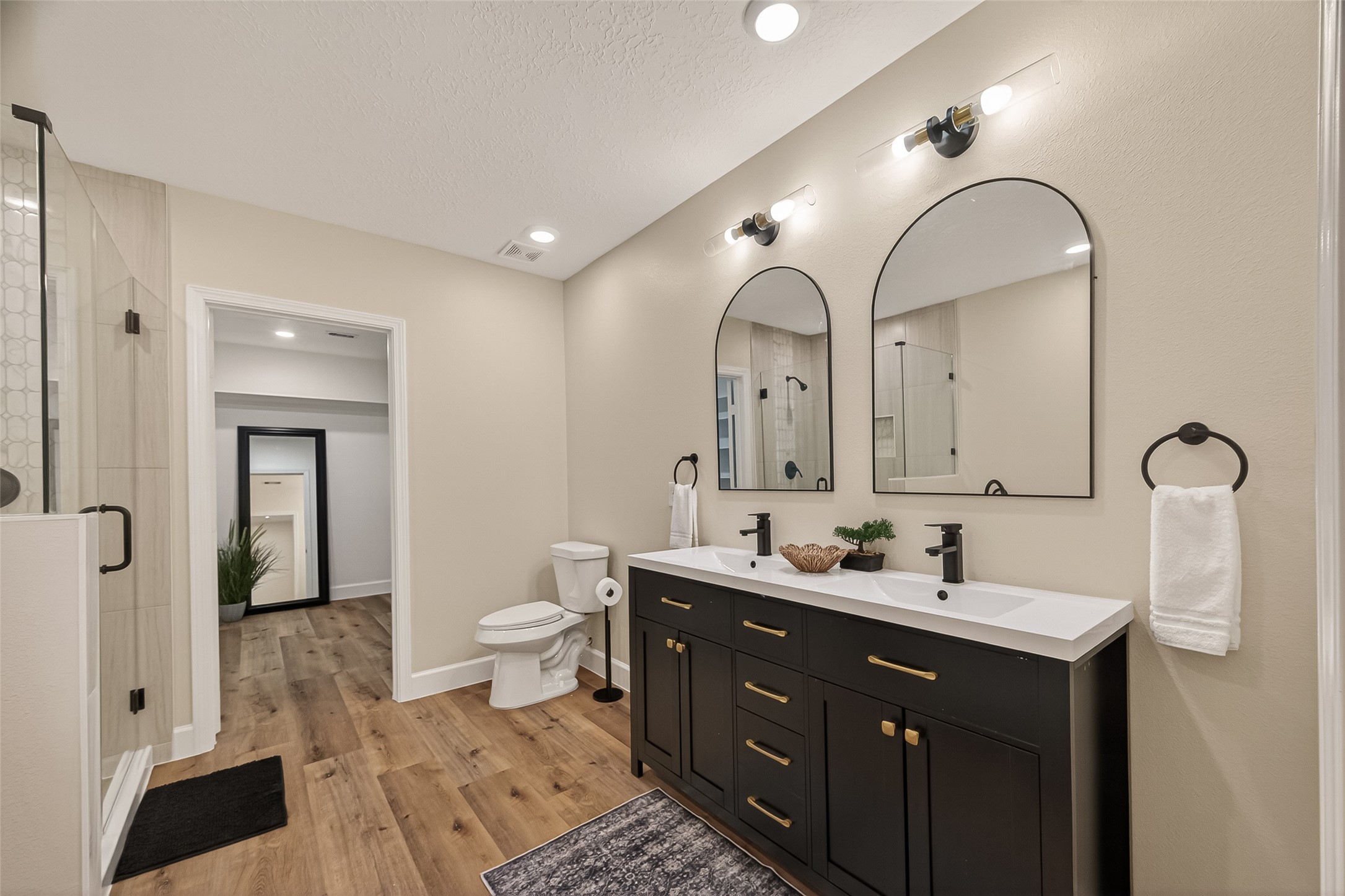 917 South Main Street Highlands, TX 77562 - Photo 34 of 45 a bathroom with a double vanity sink and a mirror