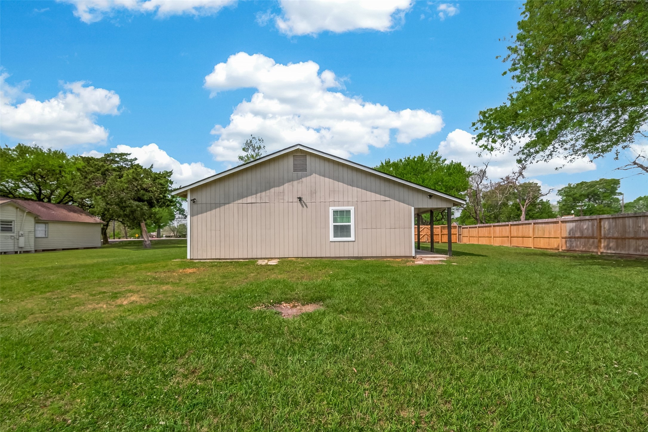 917 South Main Street Highlands, TX 77562 - Photo 38 of 45 a view of a backyard with large trees