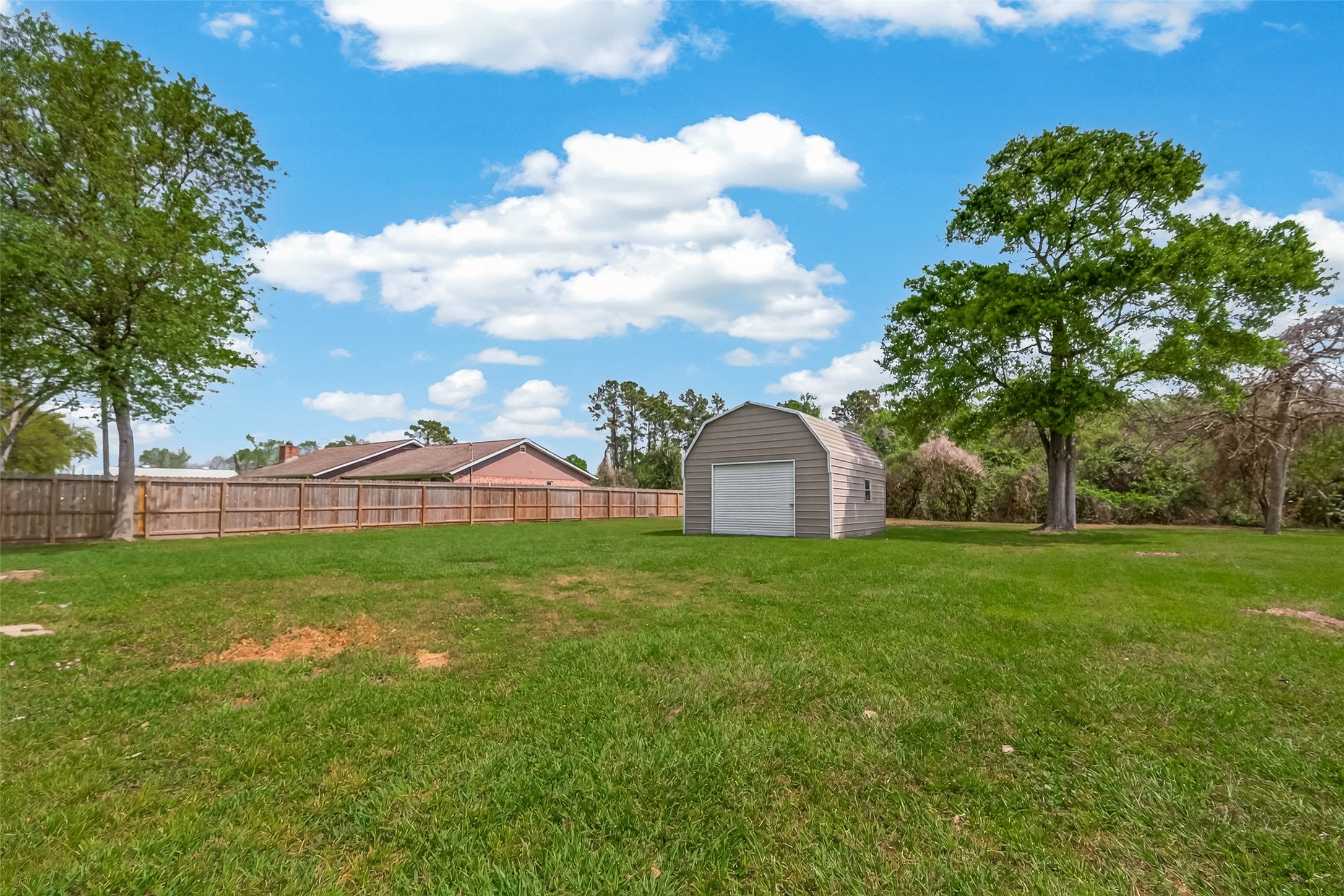 917 South Main Street Highlands, TX 77562 - Photo 41 of 45 a view of a large garden with plants and large trees
