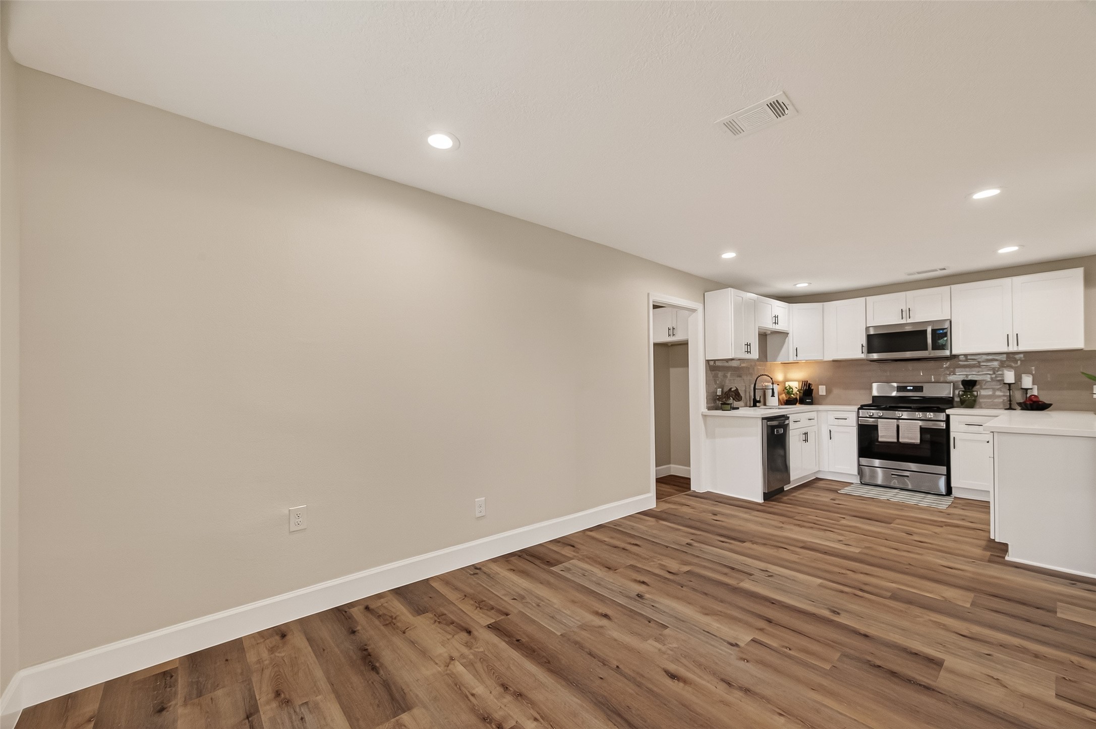 917 South Main Street Highlands, TX 77562 - Photo 10 of 45 a view of kitchen with wooden floor