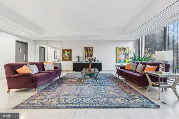 a living room with furniture and a rug