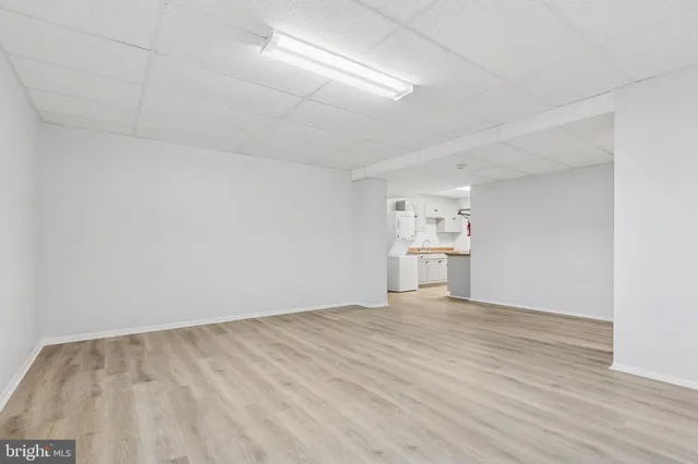 a view of a kitchen with wooden floor