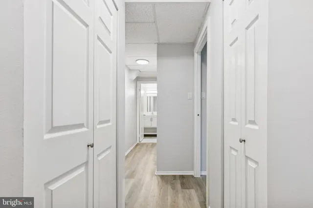 a view of a room with wooden floor