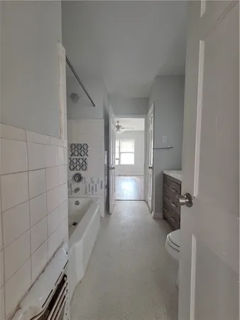 a view of empty room with air conditioner and window