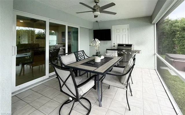 a view of a dining room with furniture window and outside view