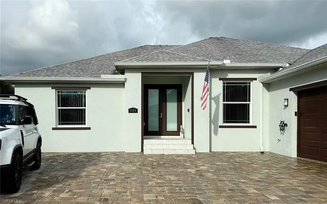 a view of a house with a parking space