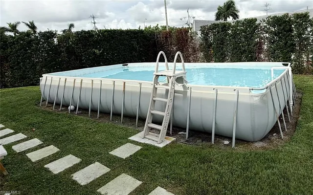 a view of a backyard with sitting area
