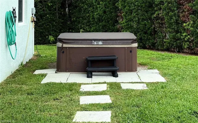 a view of a backyard with a garden and plants